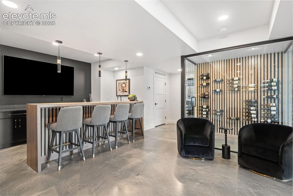Image 31 of 49: Floor to Ceiling Glass wine cellar