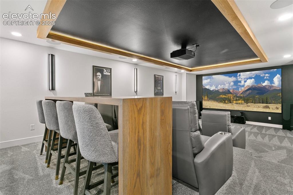 Image 35 of 49: 150" Screen with high end sound system provides a professional Movie theat
