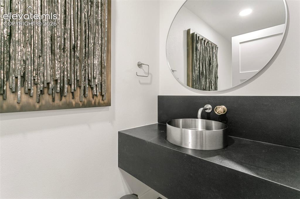 Image 36 of 49: Lower Level Powder Bath with High End Finishes