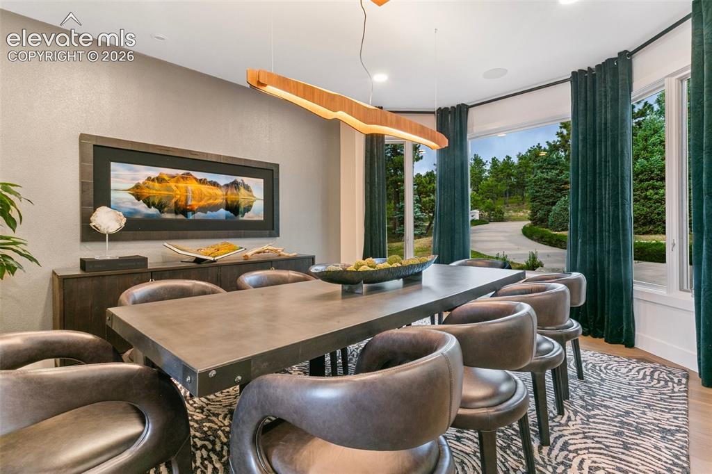 Image 5 of 49: Dining room can easily accommodate 10-12 of your favorite people.
