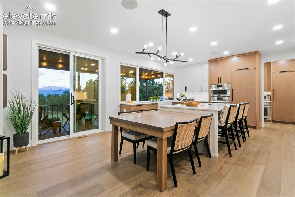 Image 8 of 49: Built in White Oak table at the kitchen island