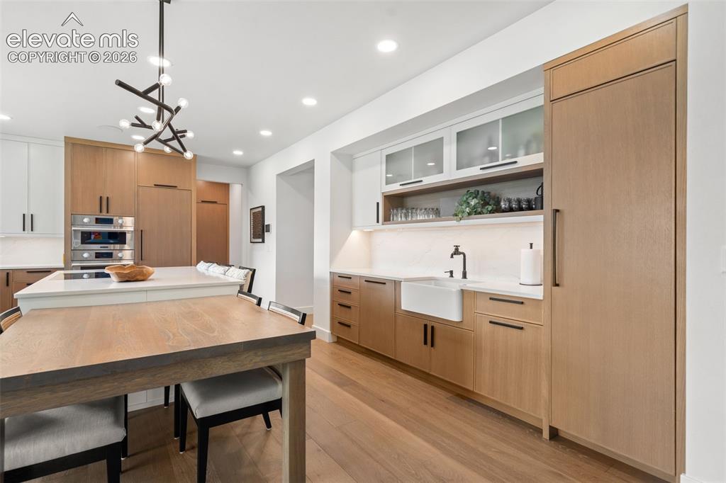 Image 9 of 49: Dedicated beverage bar complete with dishwasher and full size built-in drin
