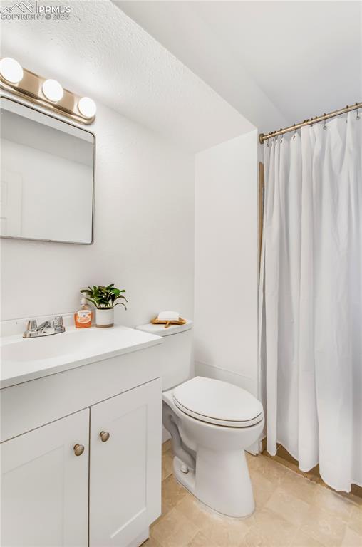 Image 21 of 25: Full bathroom featuring vanity and curtained shower