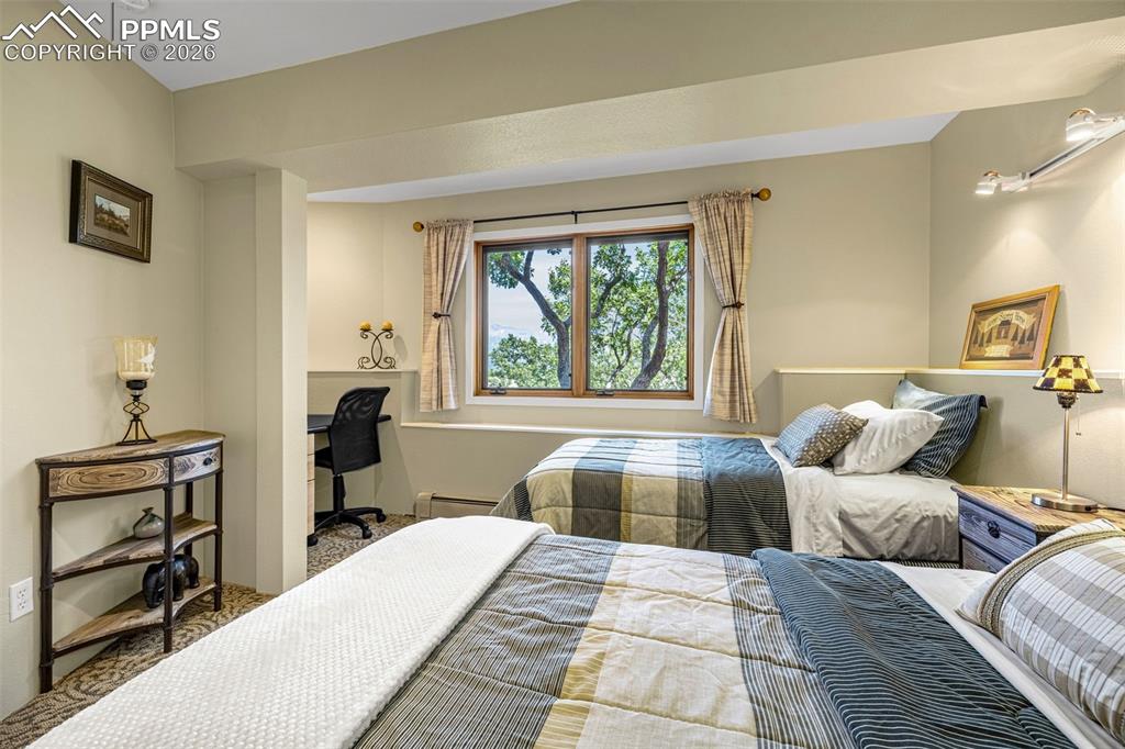 Image 12 of 42: Bedroom with baseboard heating