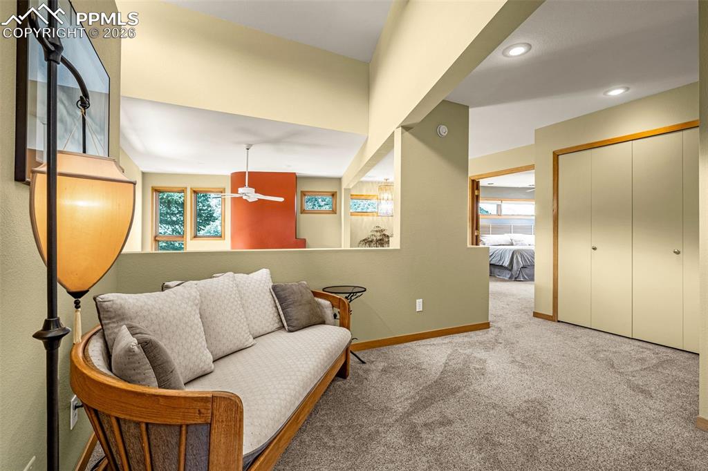 Image 13 of 42: Sitting room featuring light colored carpet, a ceiling fan, and recessed li
