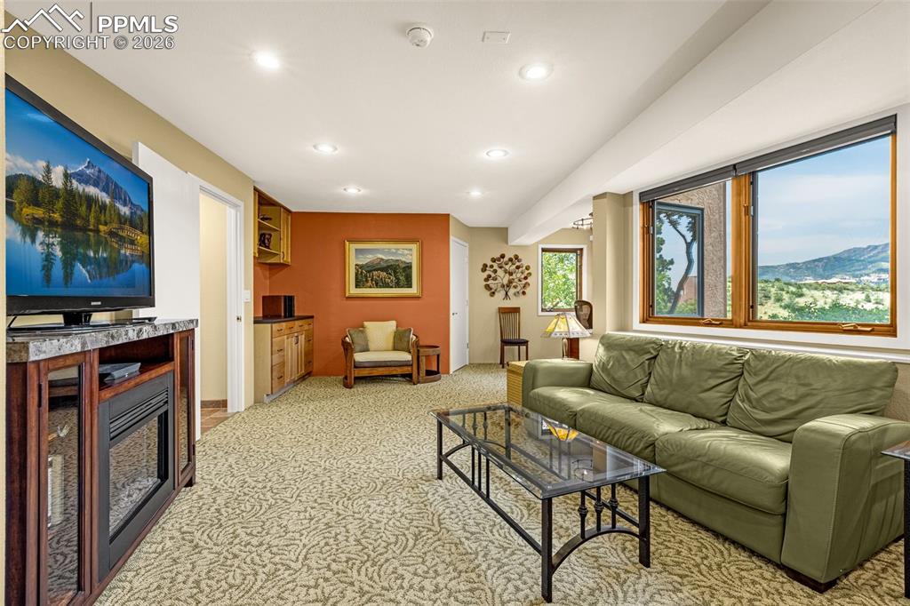 Image 9 of 42: Finished basement, garden level windows. Living room with recessed lighting