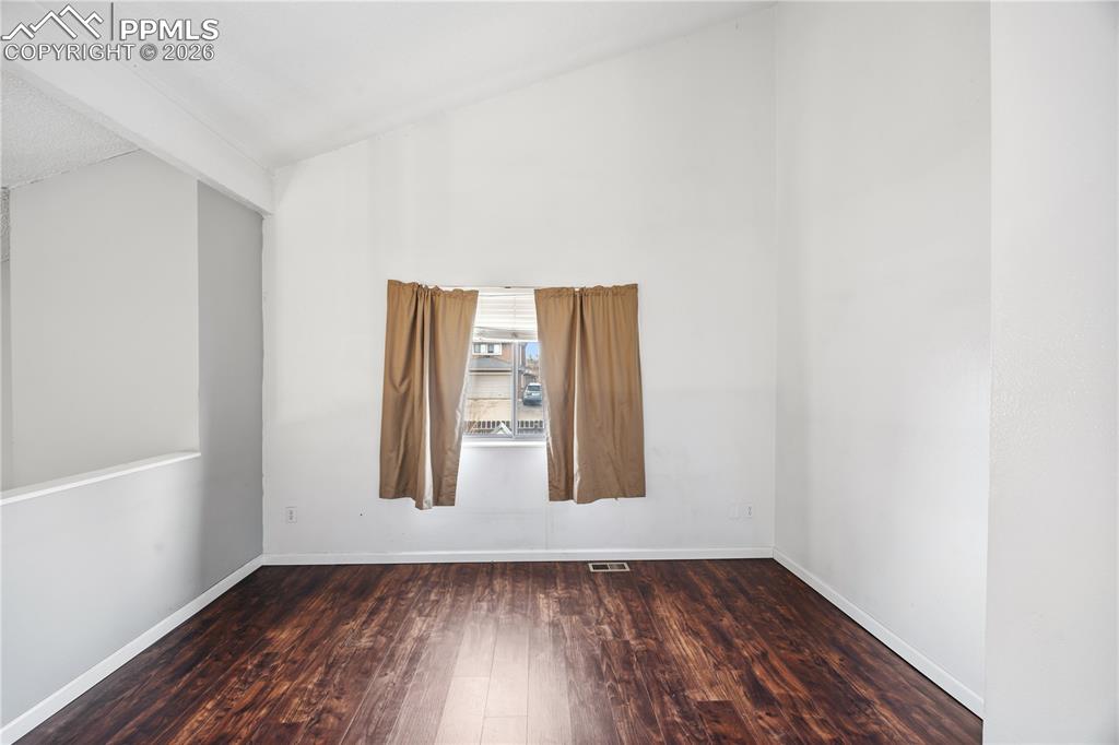 Image 11 of 27: The upper level versatile loft offers flexible use as a den, home office, o