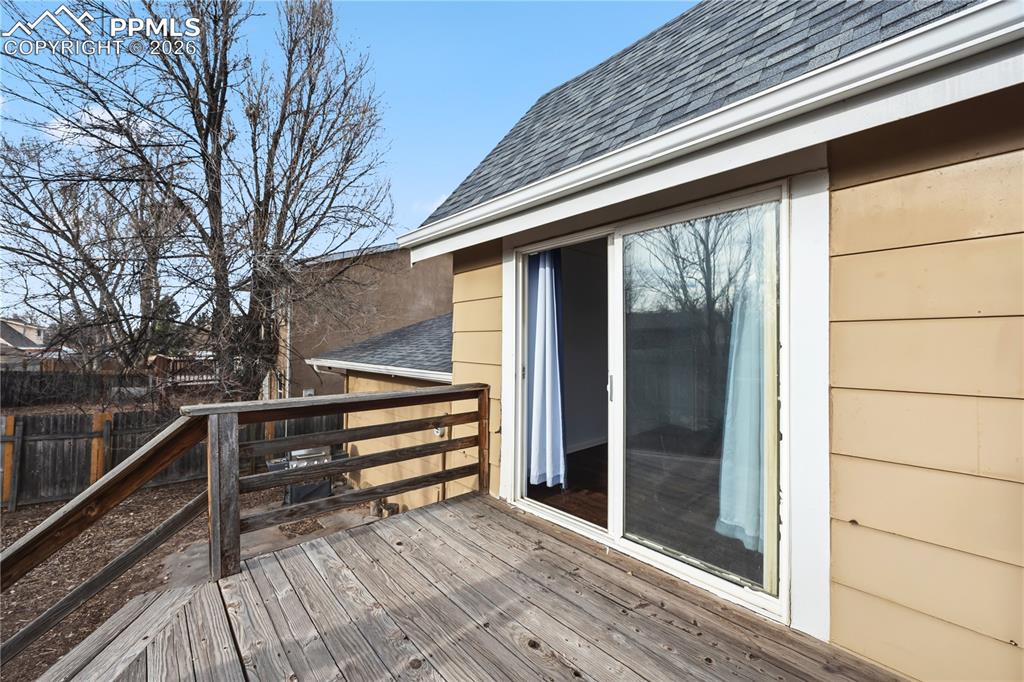 Image 14 of 27: Deck located off the primary bedroom.