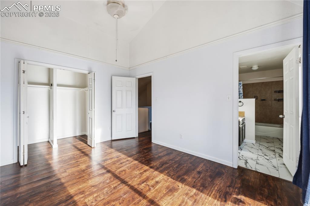 Image 15 of 27: The primary bedroom has a deep closet and an adjoining full bathroom