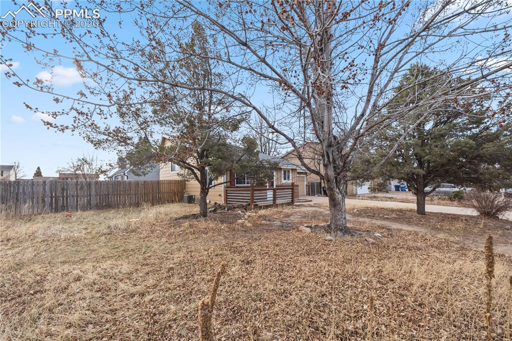 Image 2 of 27: Situated on a 0.17 acre fenced corner lot in the Southeast community of Bel