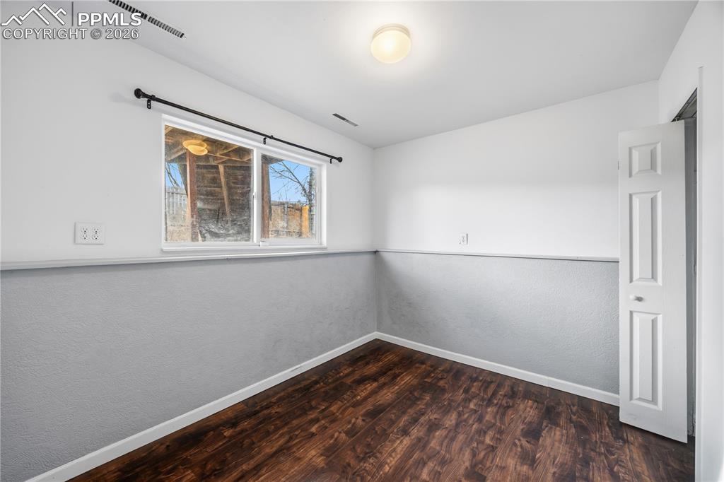 Image 22 of 27: Lower level bedroom #3 with LVP floor.