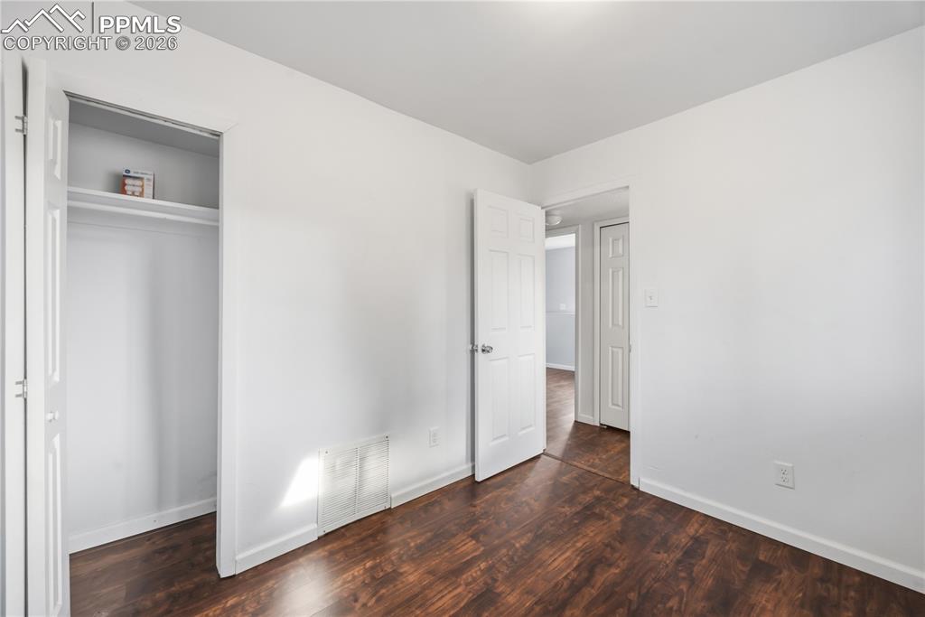 Image 23 of 27: Lower level bedroom #3 has a deep closet.