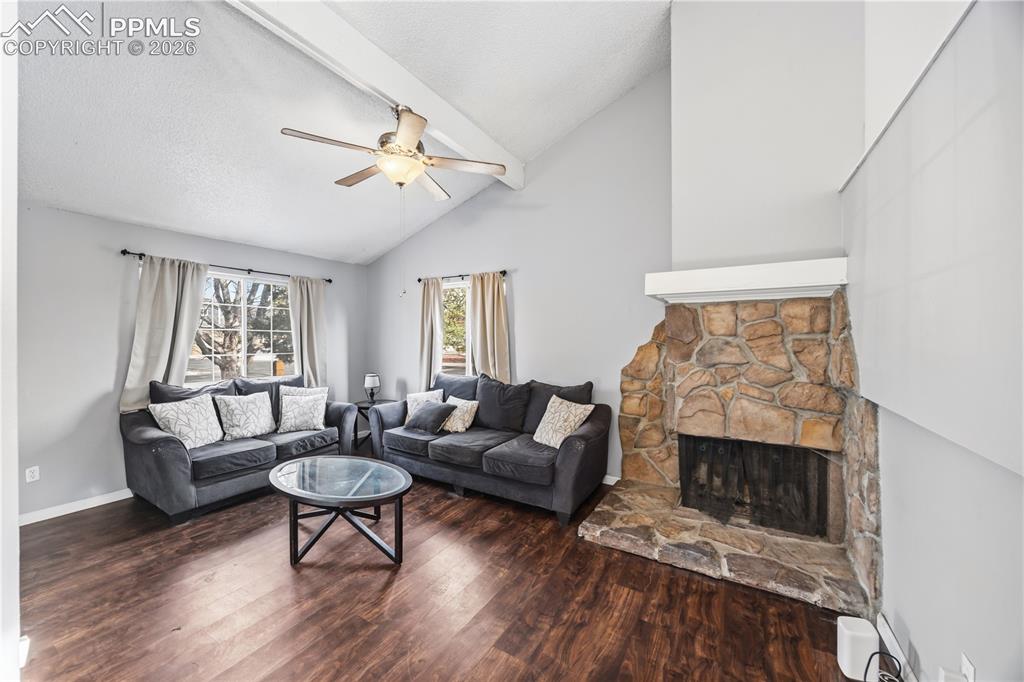 Image 6 of 27: Cozy up on chilly nights to the wood burning fireplace with stone surround.