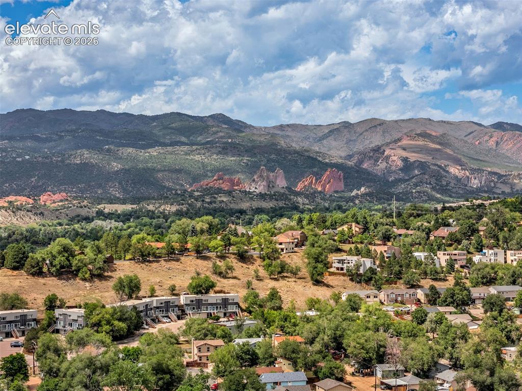 Image 44 of 50: Mountainous landscape with red rock formations