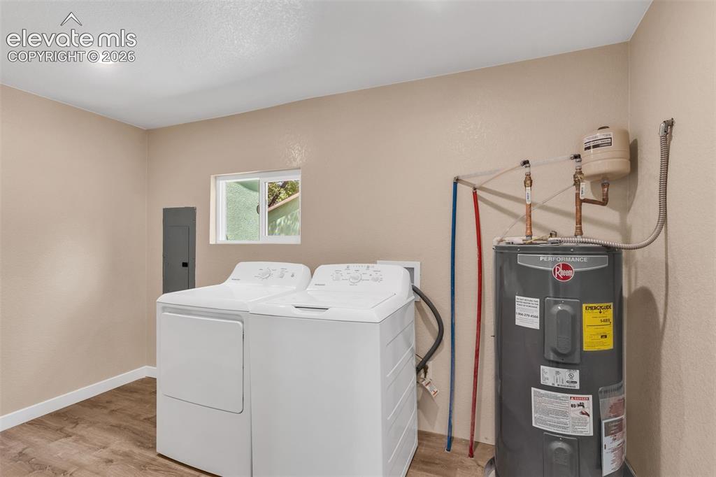 Image 50 of 50: Recessed ceiling lighting, wood-finish flooring, and a single window