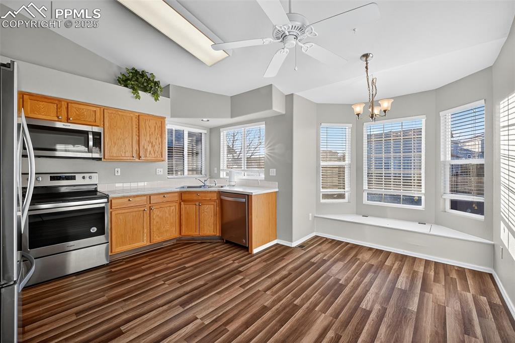 Image 14 of 41: Eat In Kitchen with a really neat bay window seating area that double as st