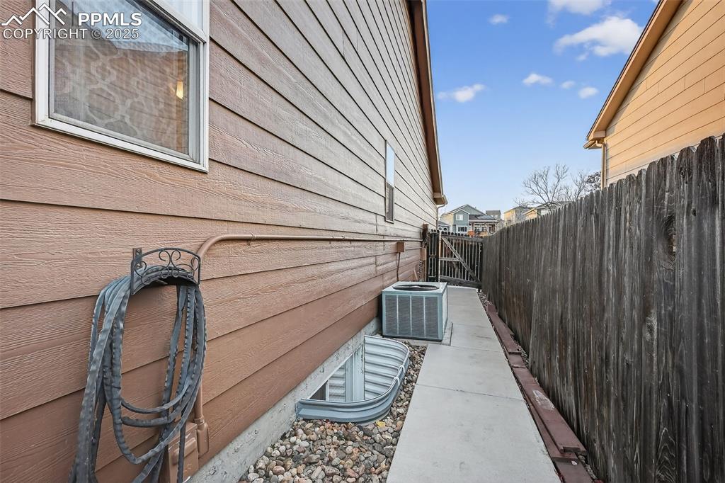 Image 35 of 41: This is the North Side of home, owner had a concrete walkway installed. 