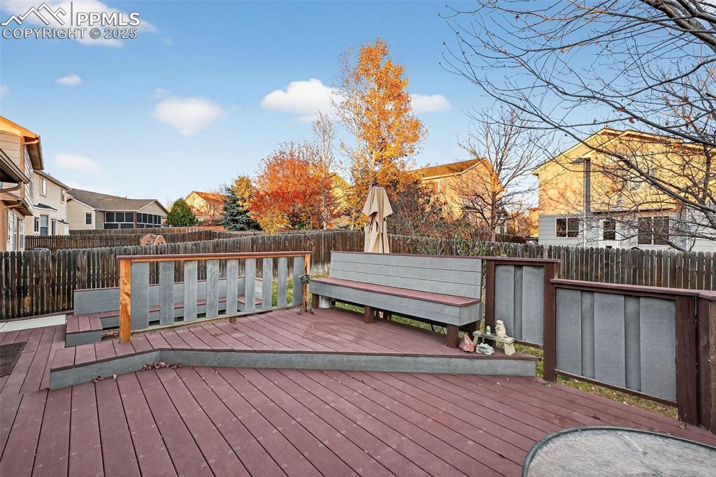 Image 37 of 41: Trex Decking with lots of built in seating and multiple levels! Maintenance