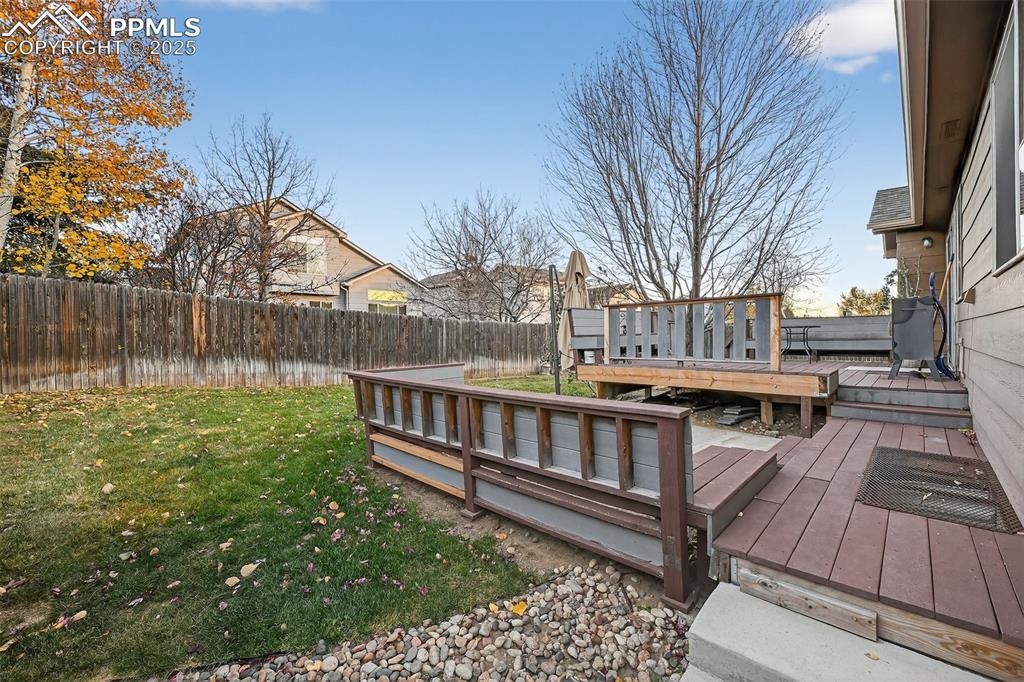 Image 38 of 41: Additional seating area around a perfect spot for a fire pit or a hot tub!