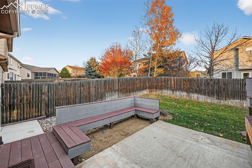 Image 6 of 41: Fenced backyard, concrete pad all ready for a swim spa or hot tub!
