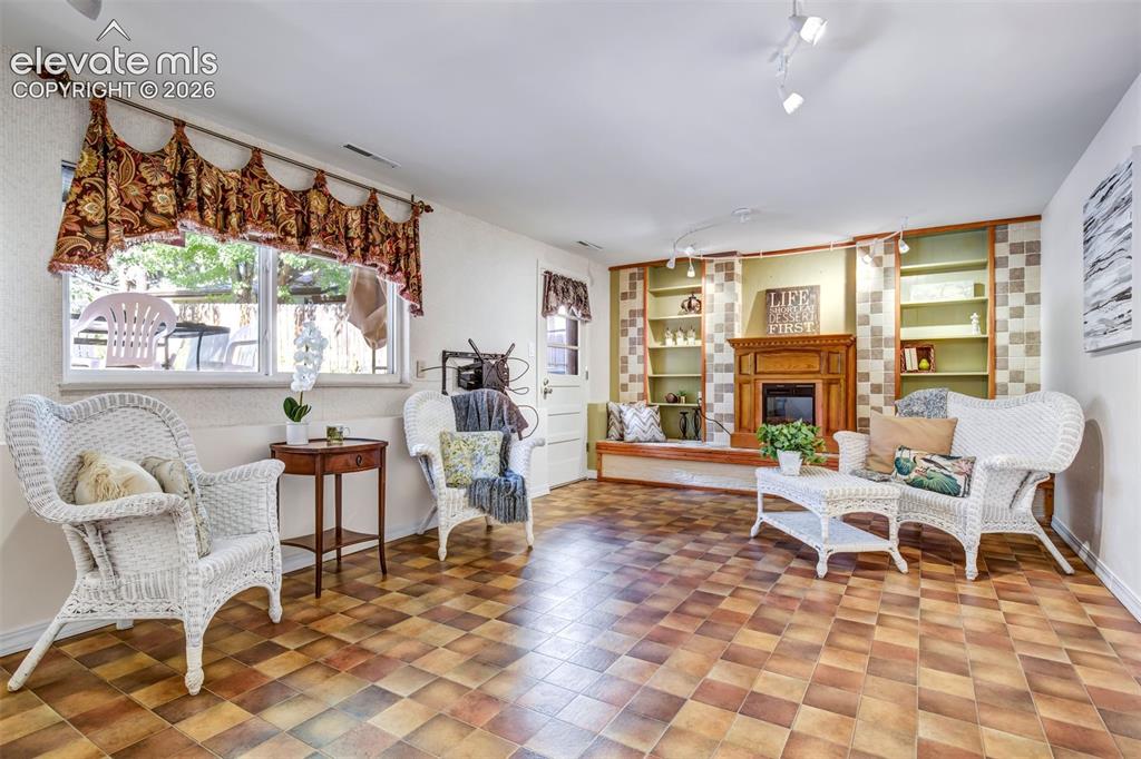 Image 21 of 48: Family Room With Electric Fireplace