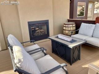 Image 27 of 36: covered area with fireplace