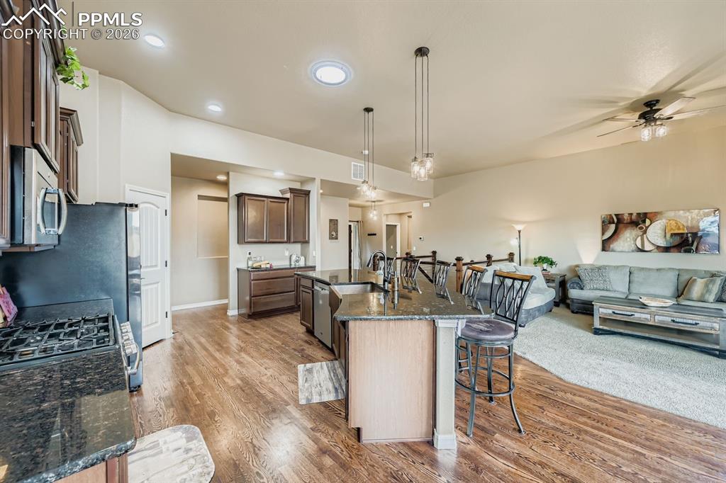 Image 9 of 36: copper sink, granite counters, stainless appliances