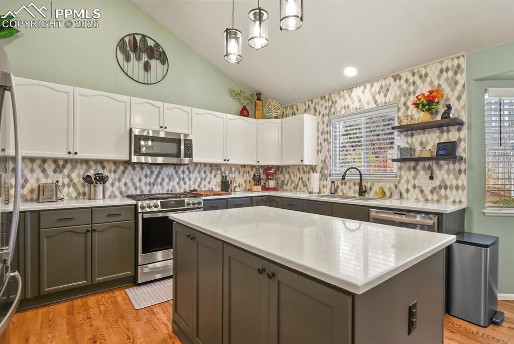 Image 12 of 43: Beautiful custom kitchen with quartz countertops.