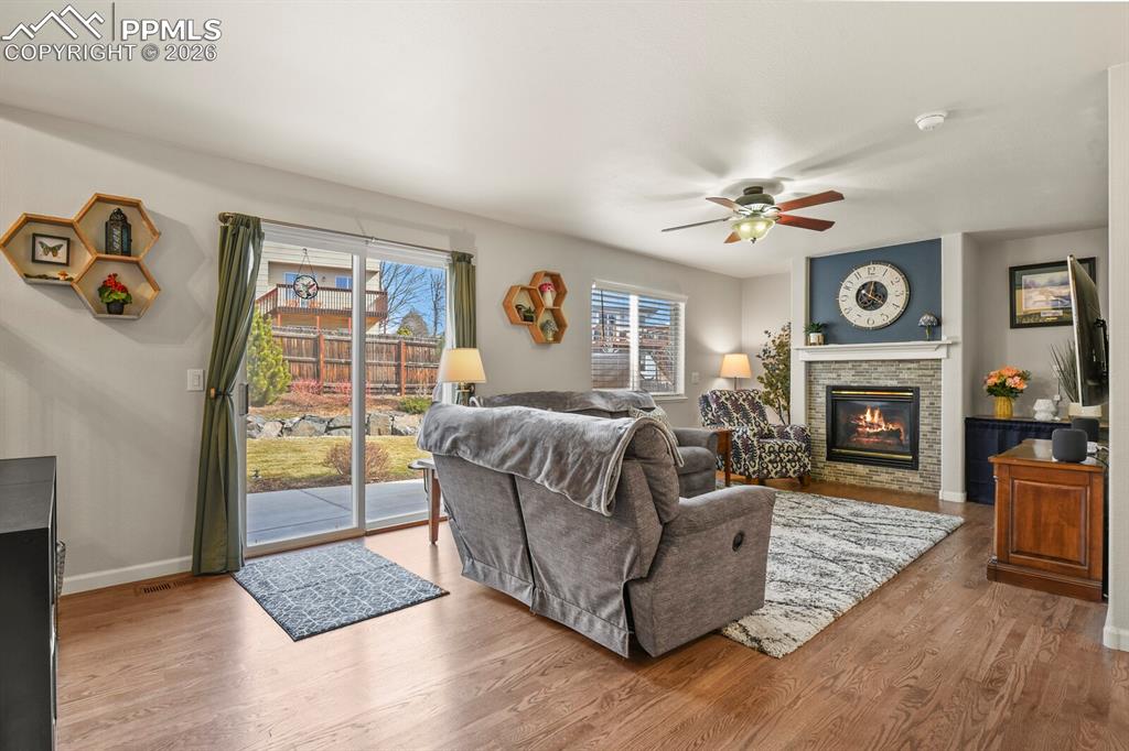 Image 18 of 43: Beautiful fireplace in the family room for those chilly Colorado nights