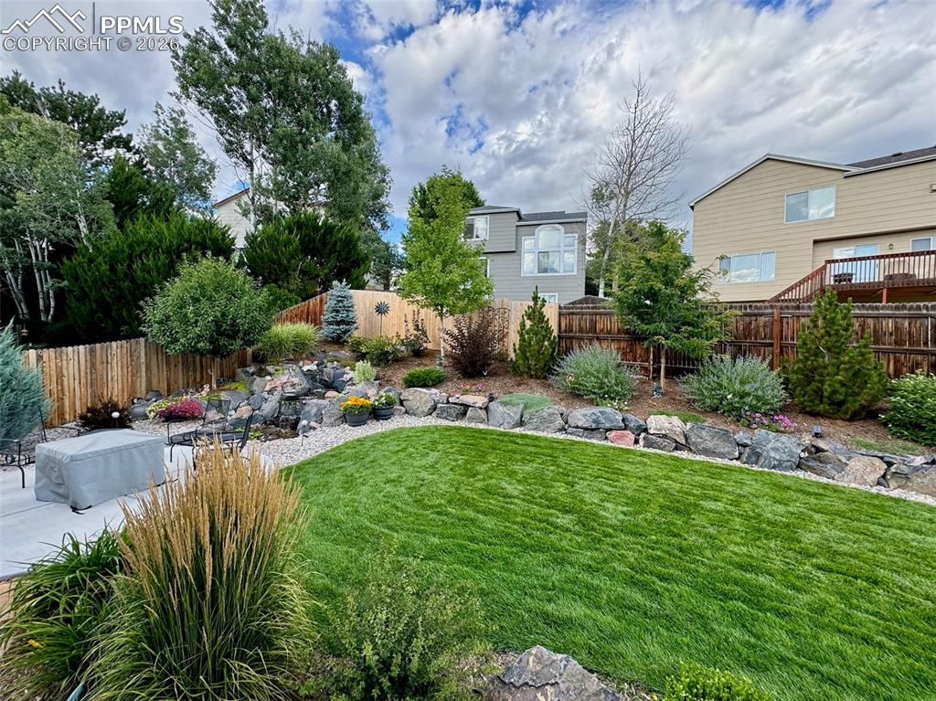 Image 2 of 43: Lots of time and effort went into making this yard incredibly beautiful 