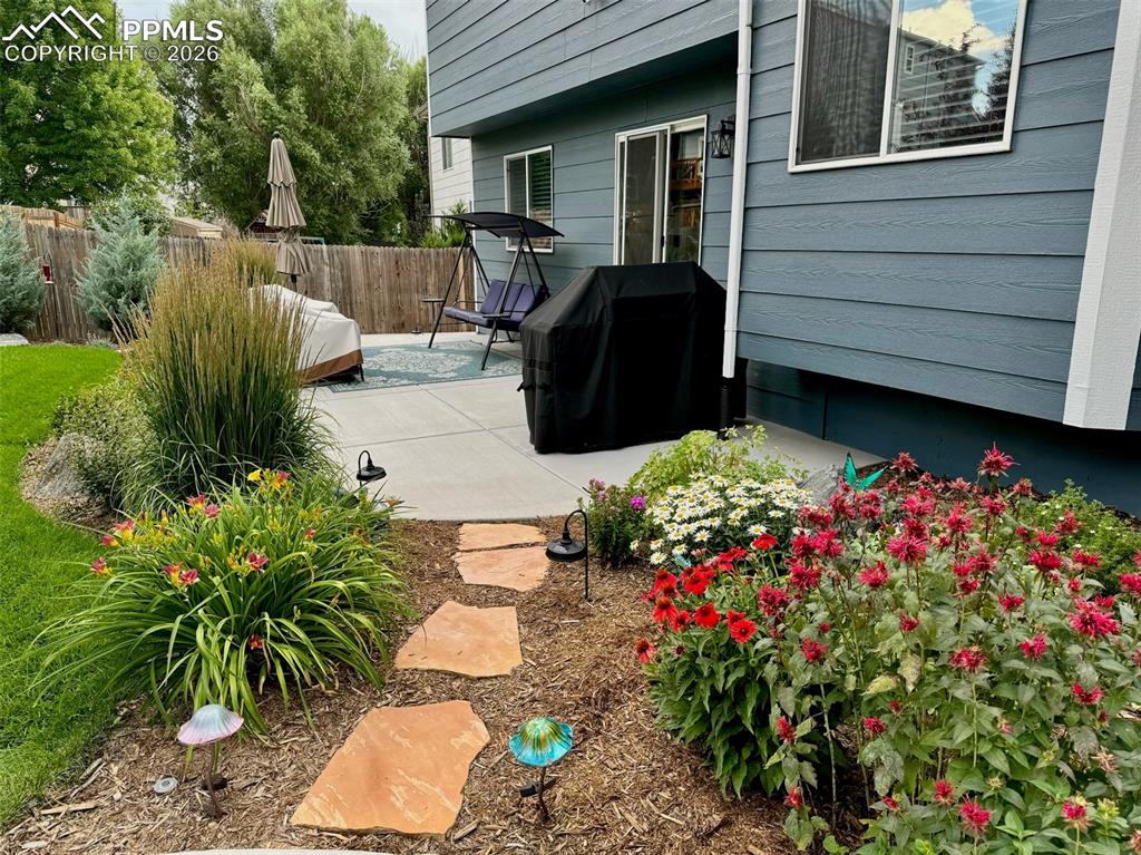 Image 43 of 43: Mature plants and trees throughout the nab, front and side of the yard.