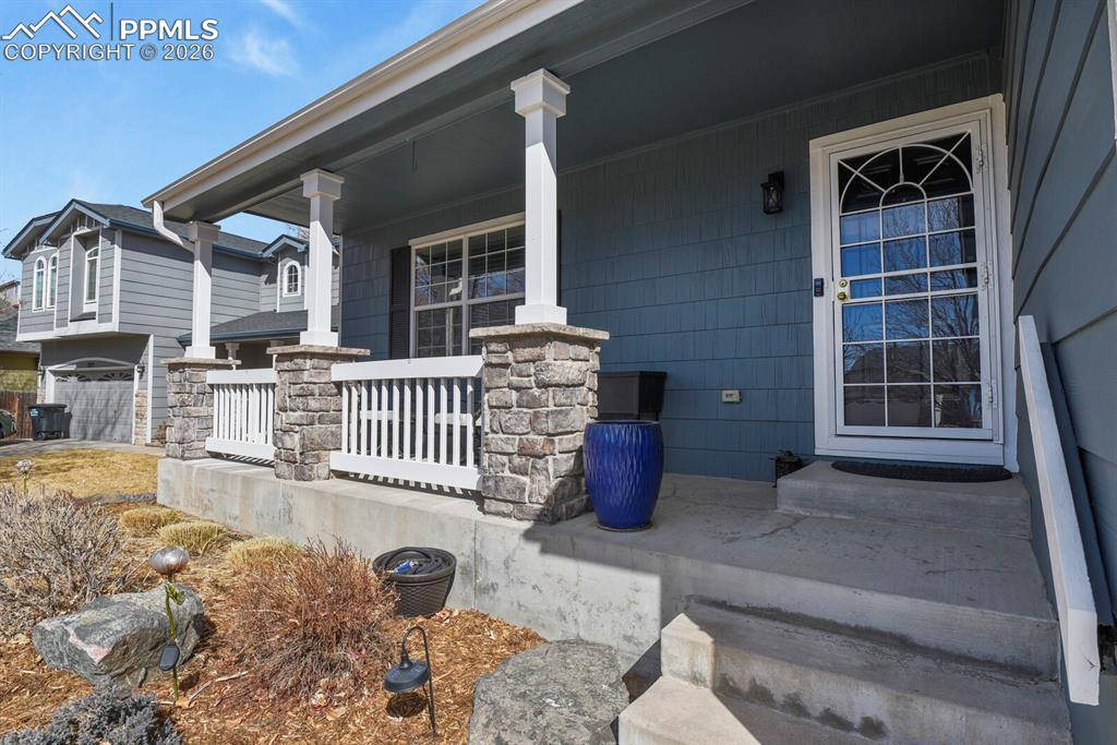 Image 7 of 43: This porch is just inviting you to come inside.