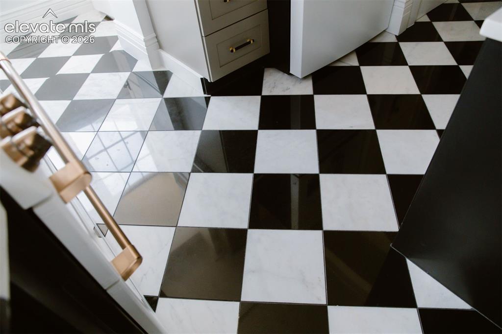 Image 23 of 50: High-contrast checkered floor tile with a polished finish