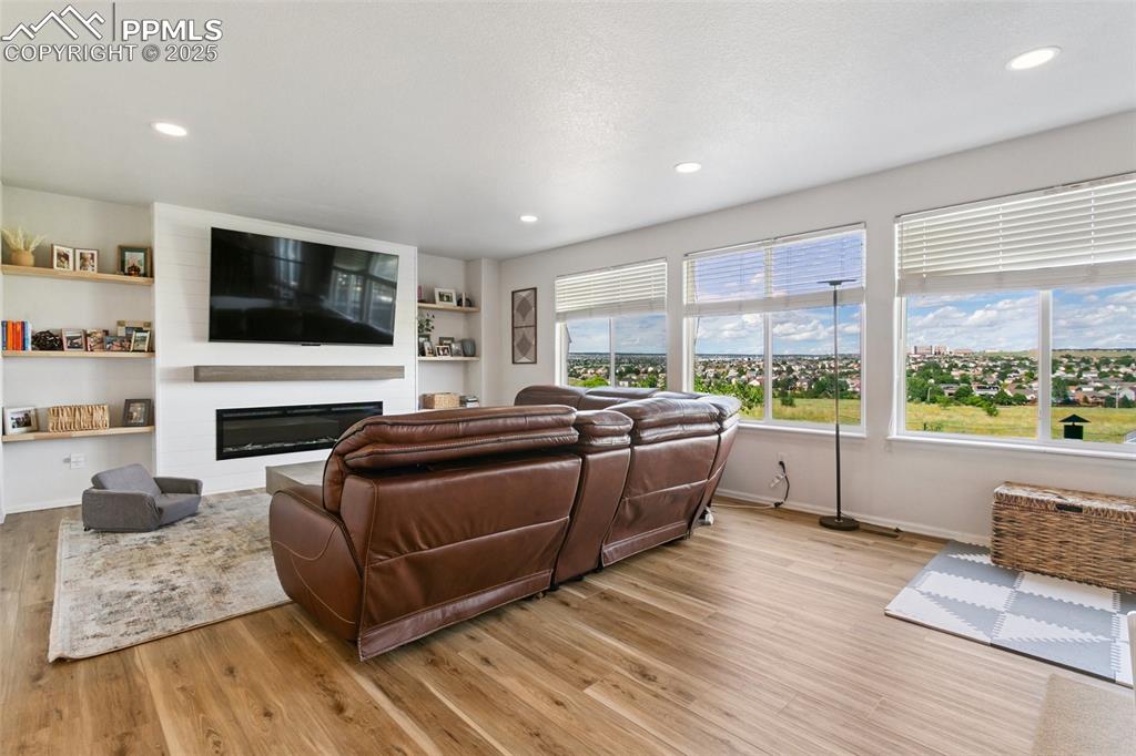 Image 14 of 41: Custom- Energy Efficent Fireplace, with hardwood shelving and New Luxury Vi