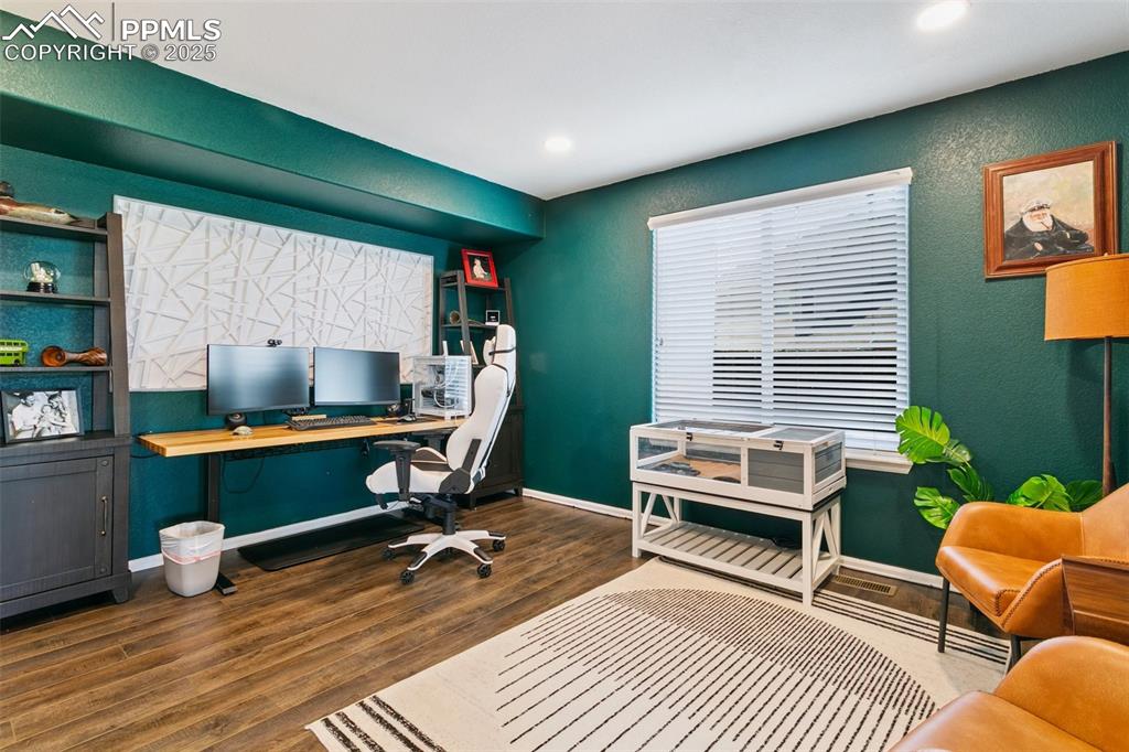 Image 17 of 41: Canned Lighting on a dimmer showing the sizeable home office with Luxury Vi