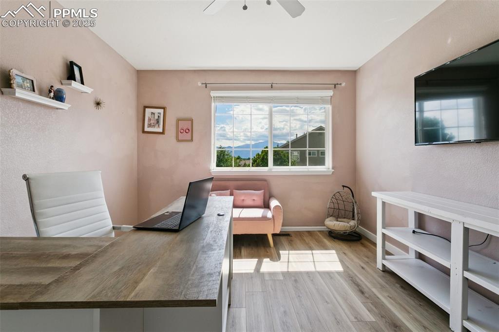 Image 24 of 41: Bedroom with beautiful view of Pikes Peak