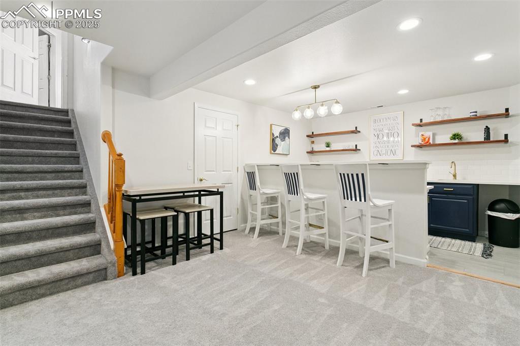 Image 28 of 41: Remodelled Wetbar and Access to crawl space