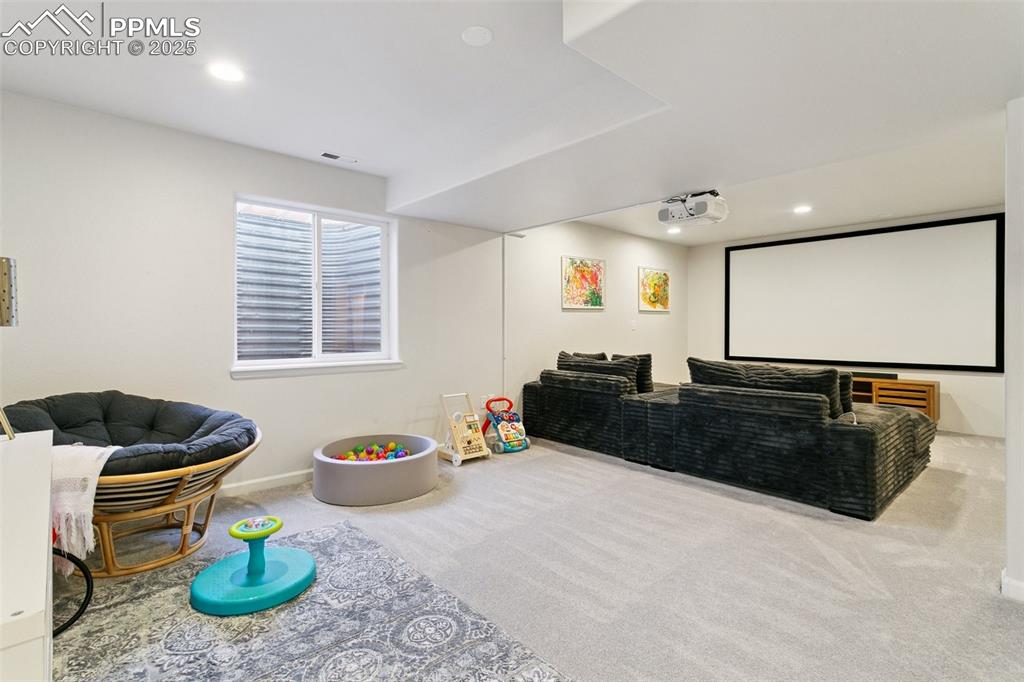 Image 30 of 41: Media Room with high end carpet and fresh finishes