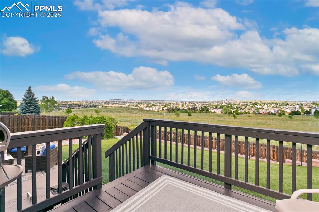 Image 35 of 41: Newly Refinished Deck to look at the open space and city views