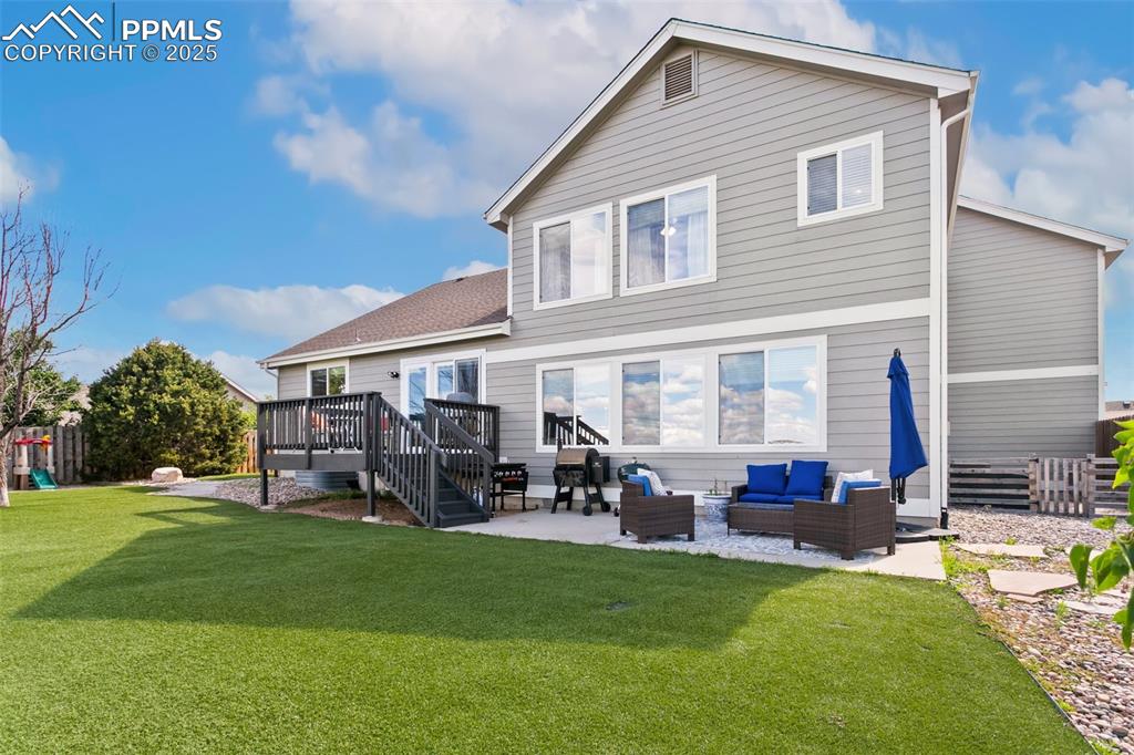 Image 36 of 41: Fully Turfed backyard with new concrete patio