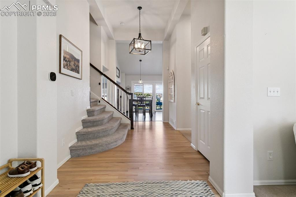 Image 8 of 41: New Light Fixtures Illumating the Front Entry