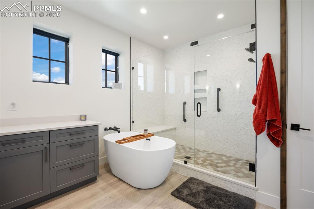 Image 32 of 39: Both lower level bedrooms feature private ensuites, but one is a deluxe 5-p