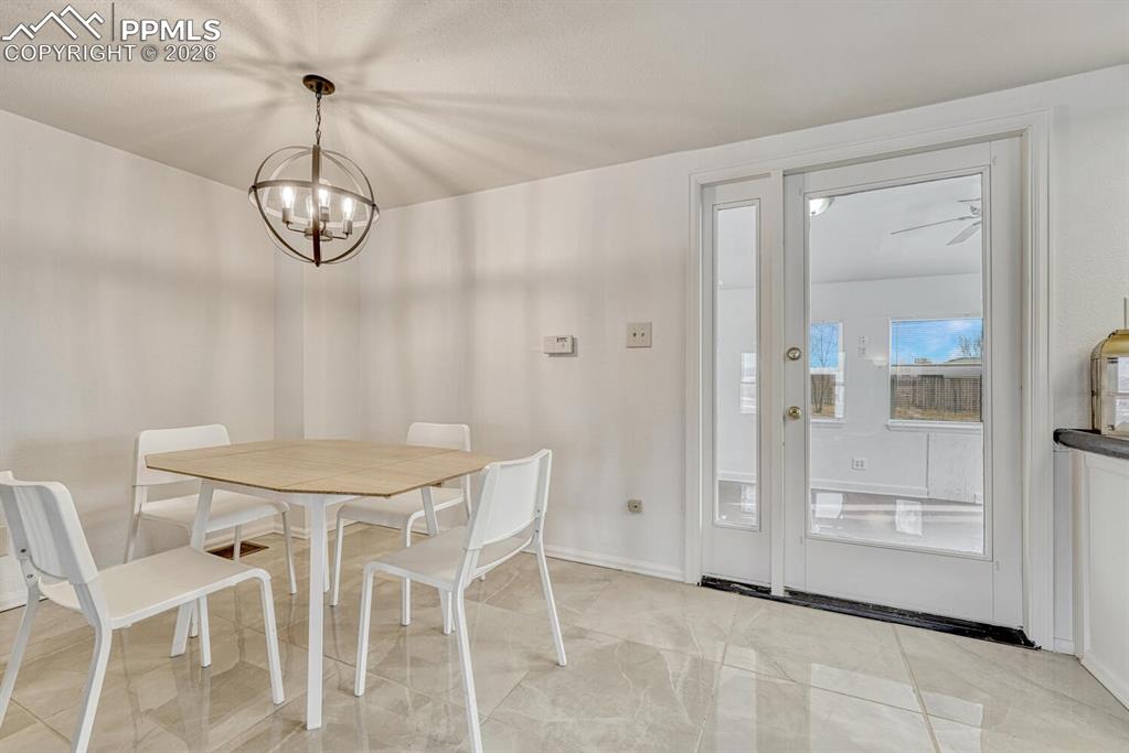 Image 10 of 42: ceramic tile dining area