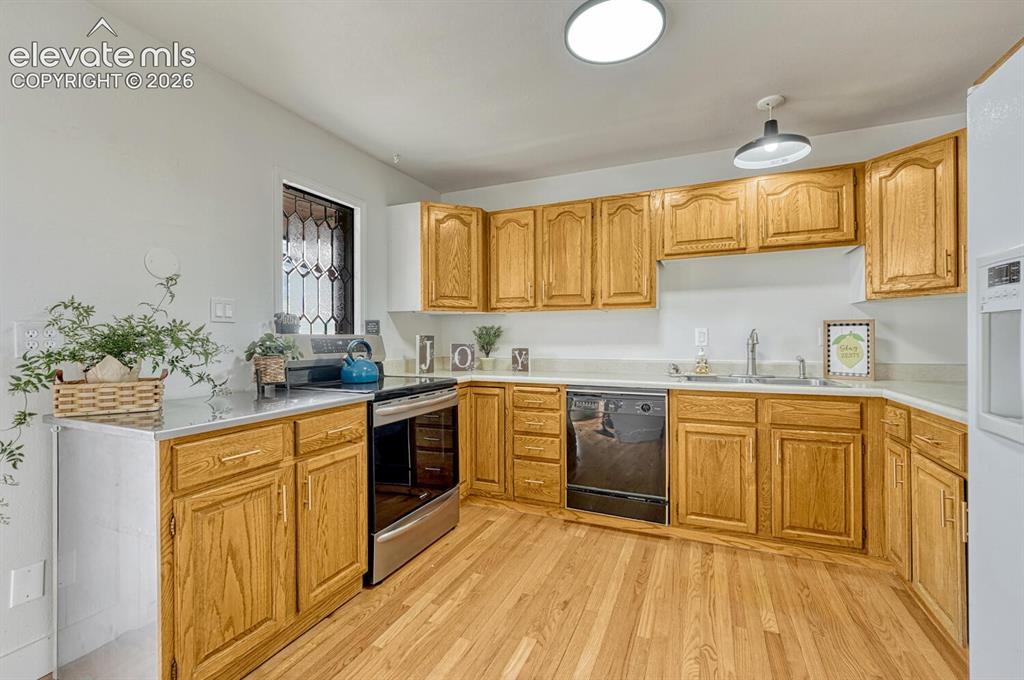 Image 18 of 42: kitchen with leaded glass window, lots of light