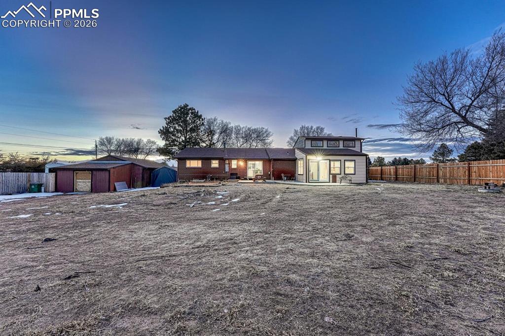 Image 30 of 42: From the backyard, looking West toward the home.