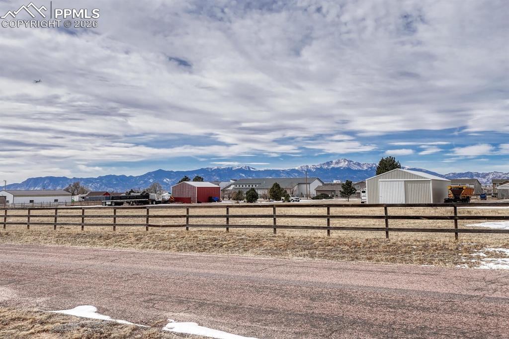 Image 36 of 42: Front of the house with sweeping front range views and perfect Pikes Peak v