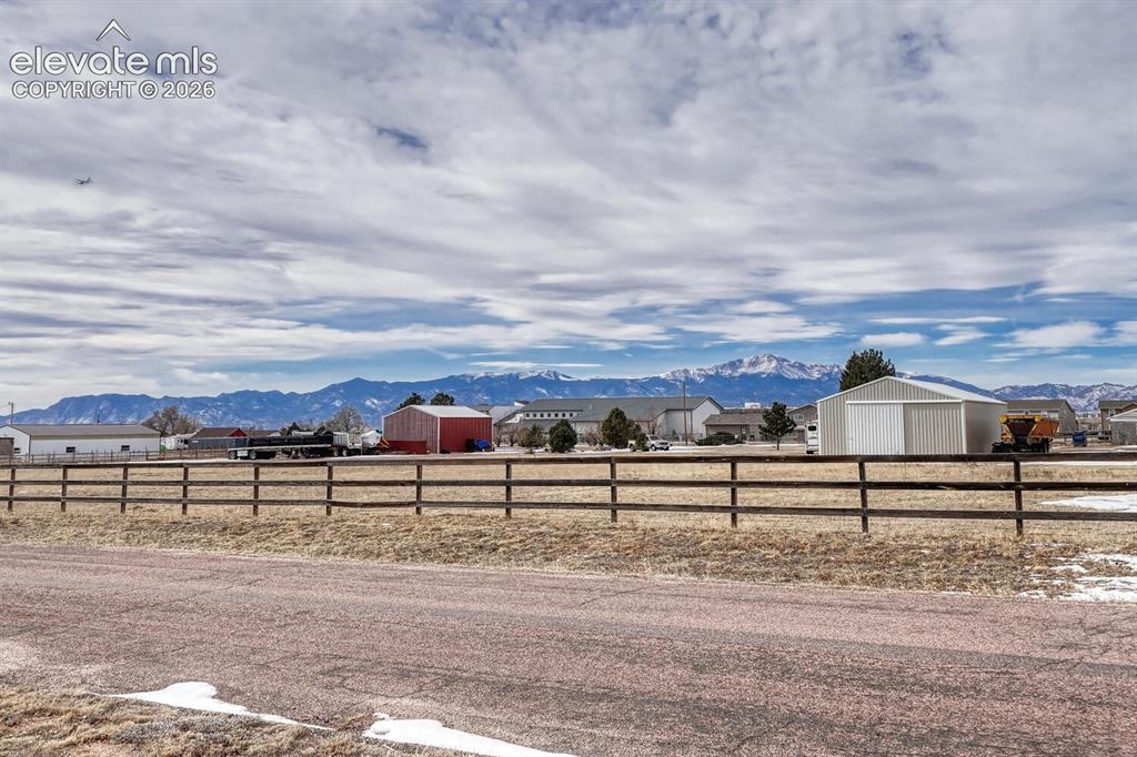 Image 36 of 42: Front of the house with sweeping front range views and perfect Pikes Peak v