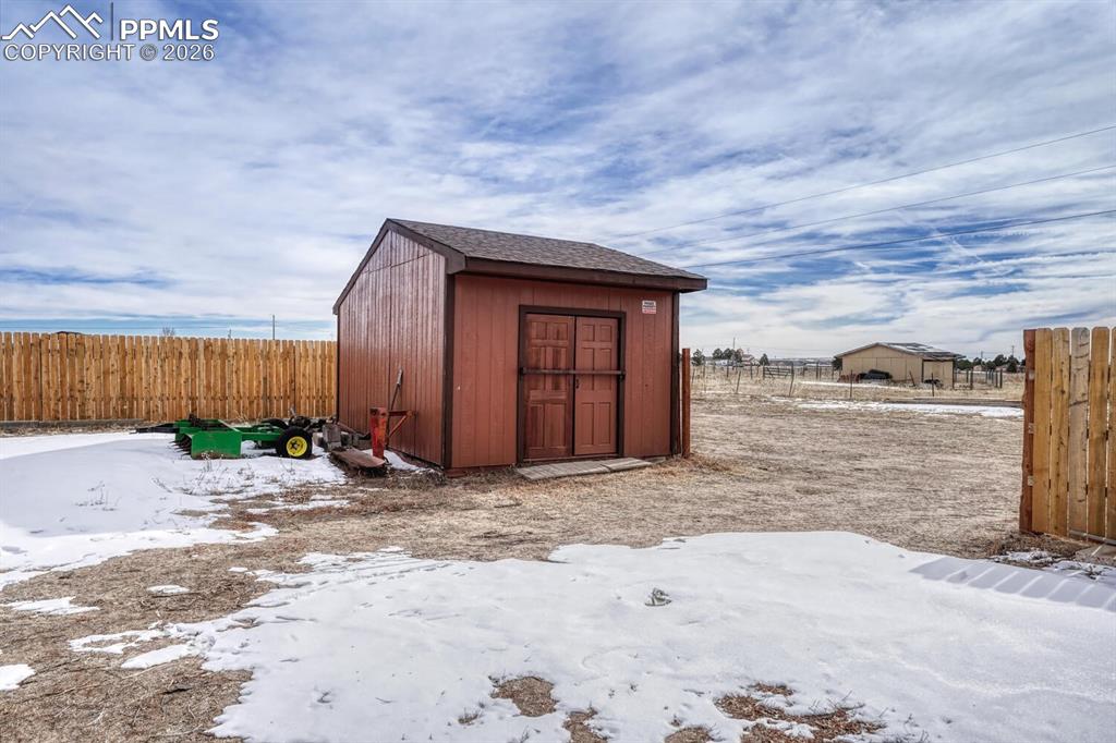 Image 39 of 42: second storage shed, gate from fence.