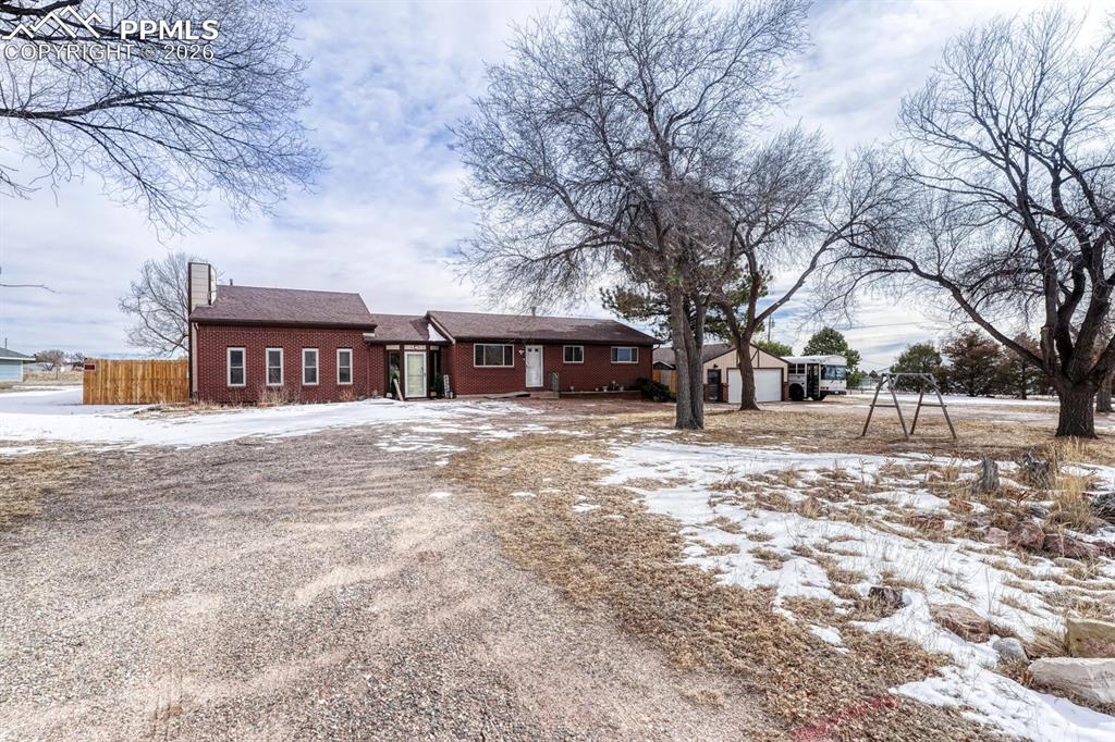 Image 41 of 42: Circular Driveway with huge detached garage with attached shed and workroom