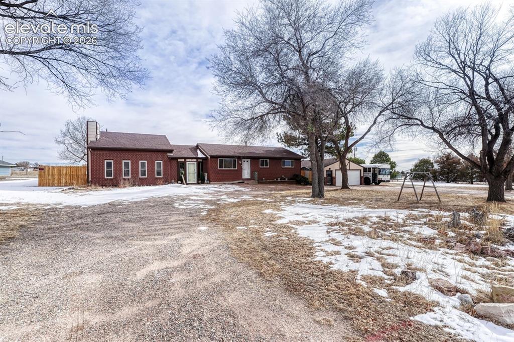 Image 41 of 42: Circular Driveway with huge detached garage with attached shed and workroom